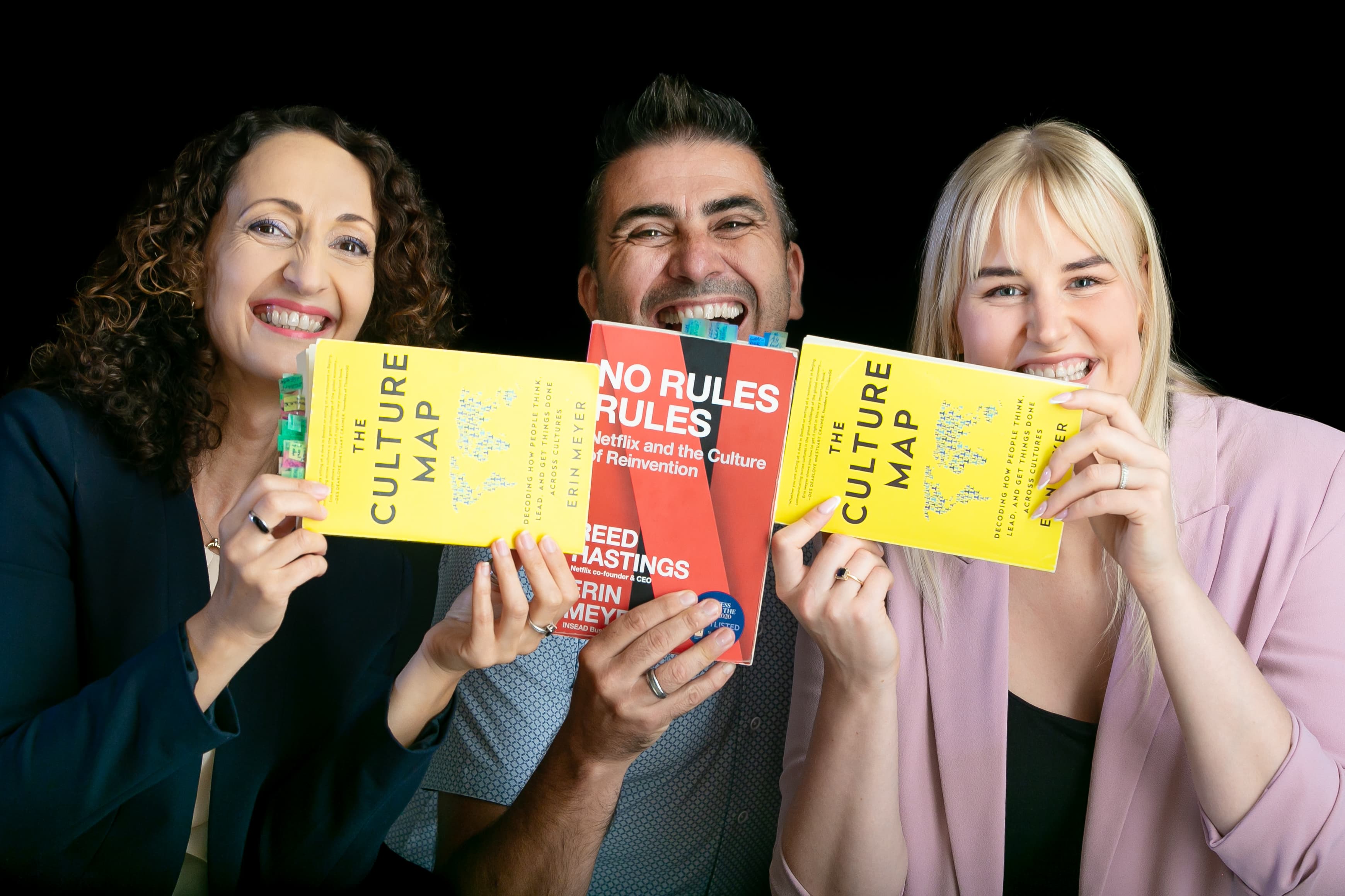 EYBA team with business and culture books